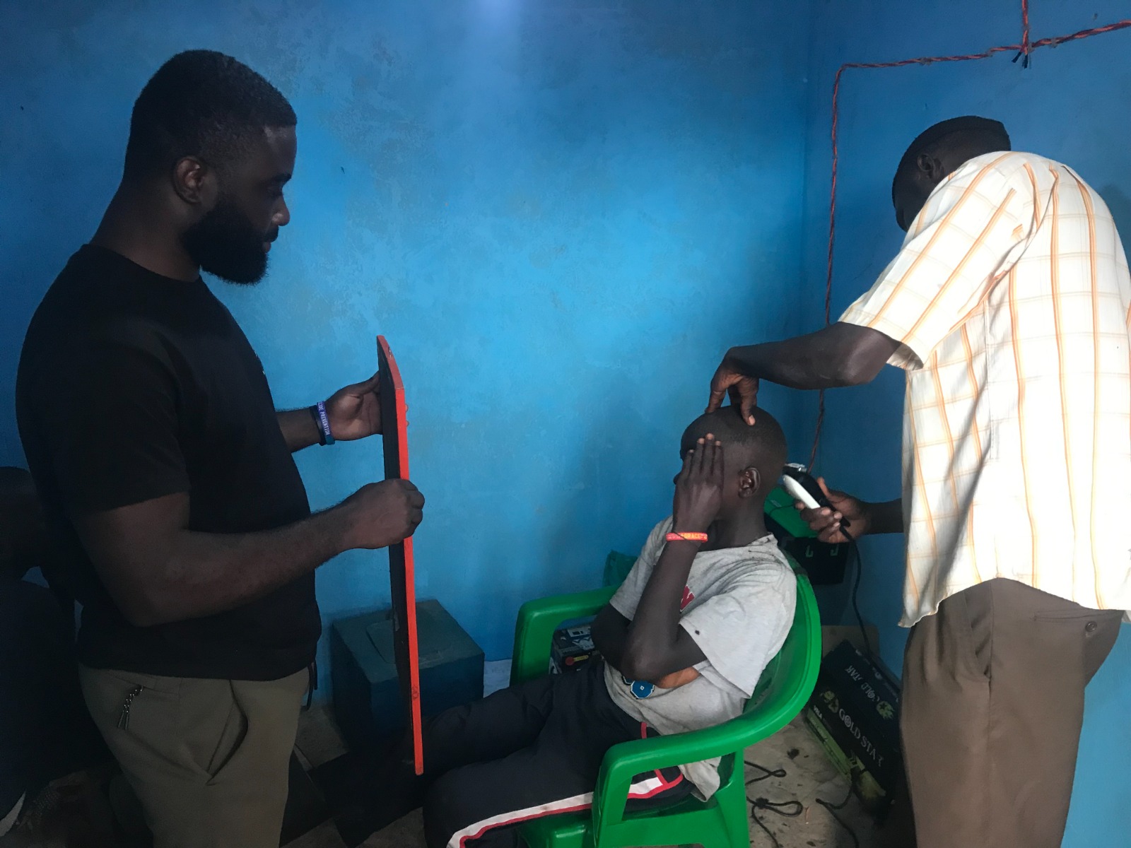 Barber cutting a child’s hair hygienically